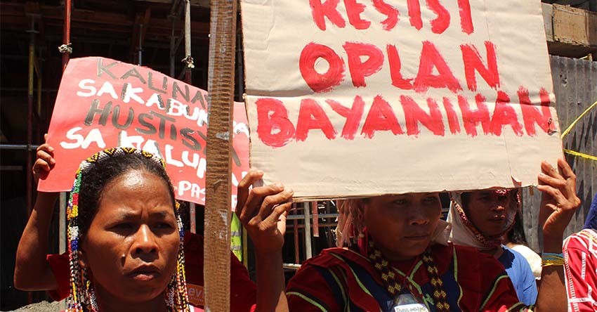 Lumads form human chain outside AFP camp to protest abuses